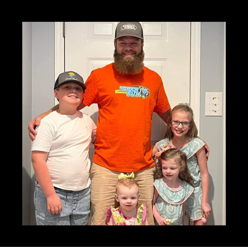 Dustin Wilkie and family representing Wilk's Junk Service, showcasing their commitment to community and family values.