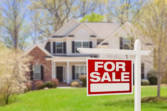 For Sale sign in front of a large suburban house, highlighting Wilk's Junk Service's role in helping real estate agents prepare properties by removing unwanted items and ensuring a clutter-free presentation.